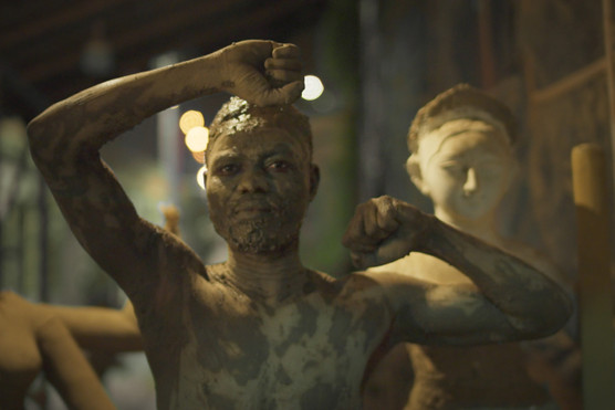 A DOLL MADE UP OF CLAY